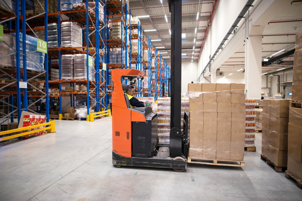 industrial-worker-protective-uniform-operating-forklift-big-warehouse-distribution-center.jpg