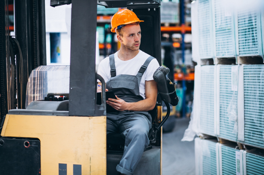 young-man-working-warehouse-with-boxes.jpg